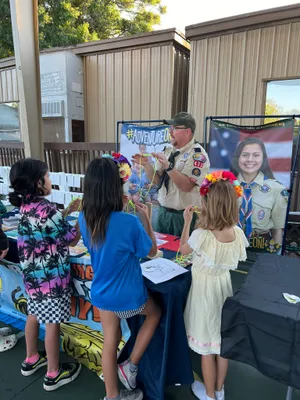 Kids at the recruiting booth watching a knot demostration